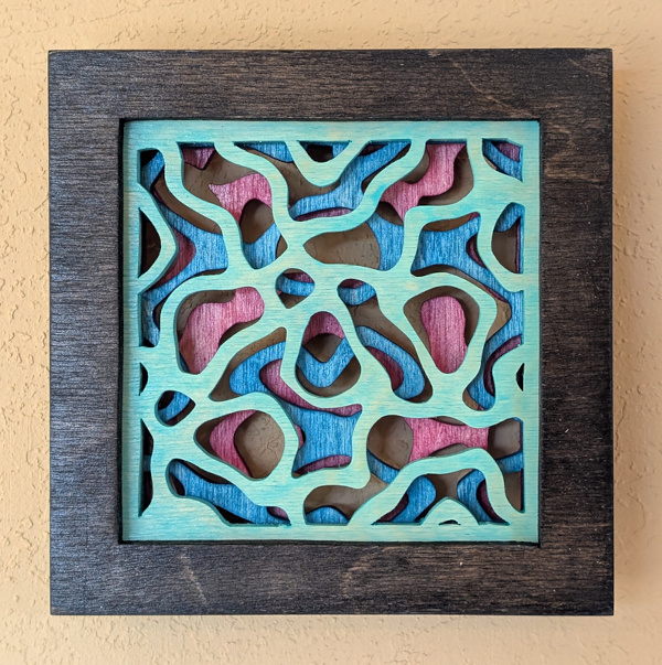 Smaller fractal pattern cut from wood layers